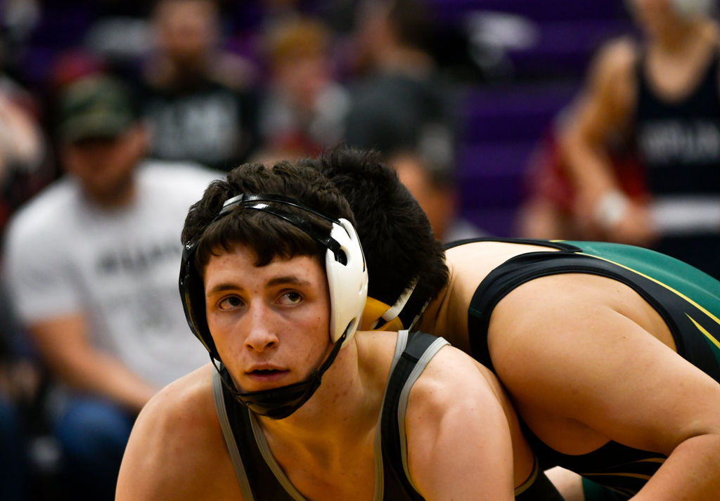 Willard's Garrett Smith, left, looks up at the official during his match
